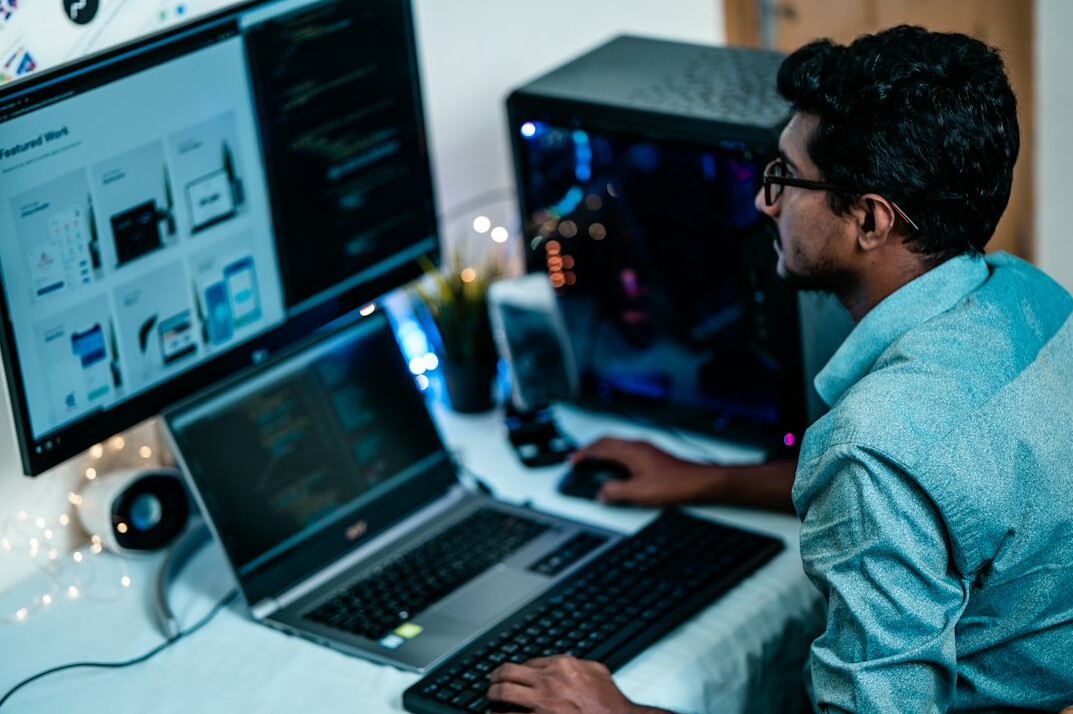 software developer coding at desk