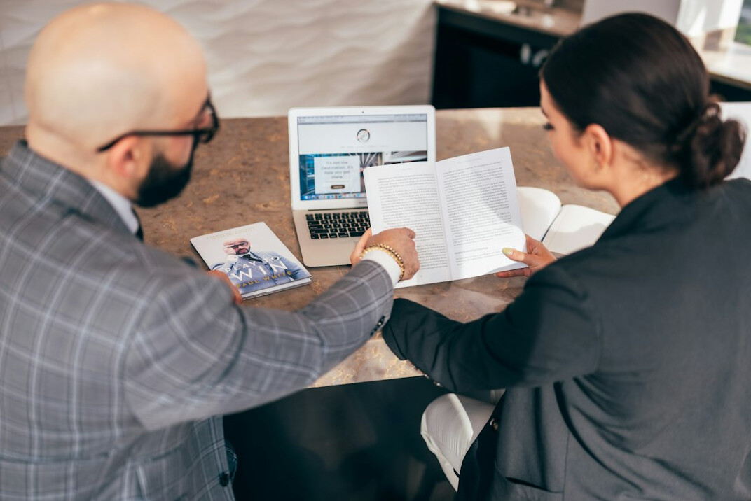 insurance agent discussing policy with client