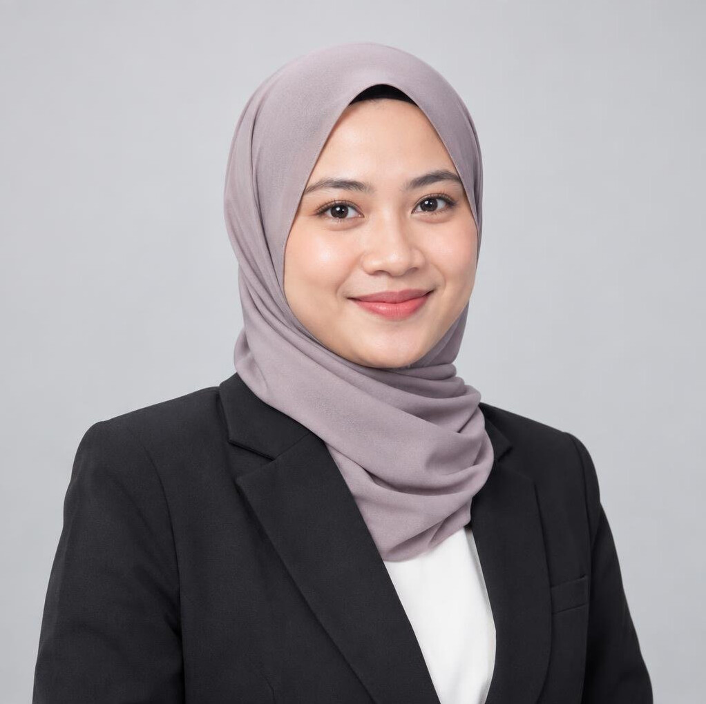 Studio portrait of a Malaysian woman actuarial analyst smiling